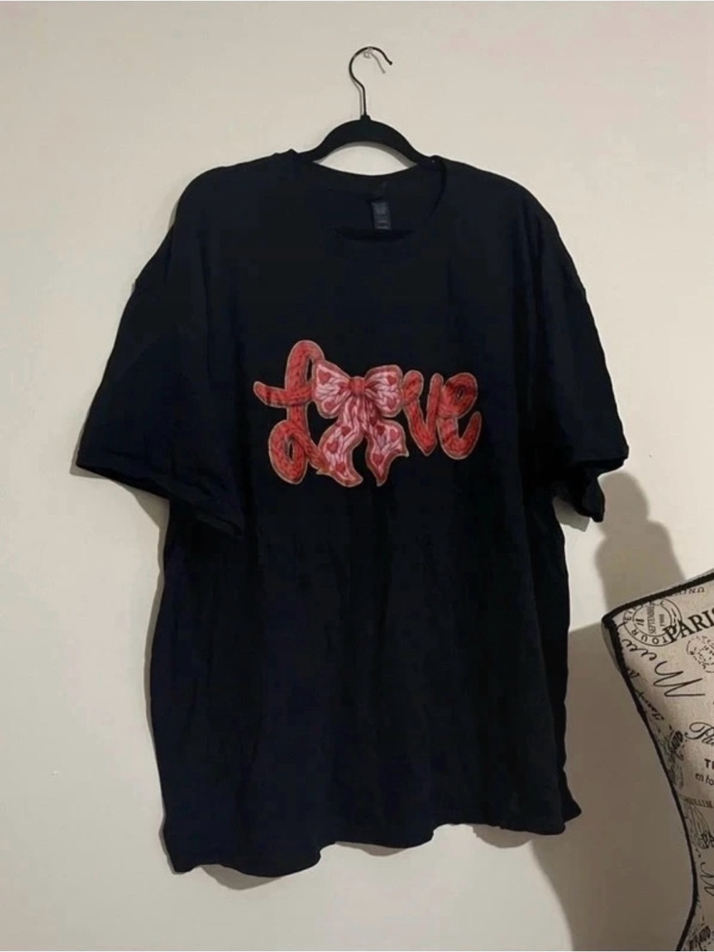 Black Graphic Tee with Red 'Love' Bow Design